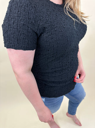 VMCALISSIA SS ASSYMETRICAL O-NECK TO CUR Black